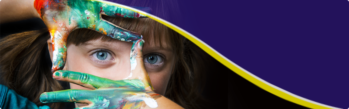 child with paint on her hands painting a portrait